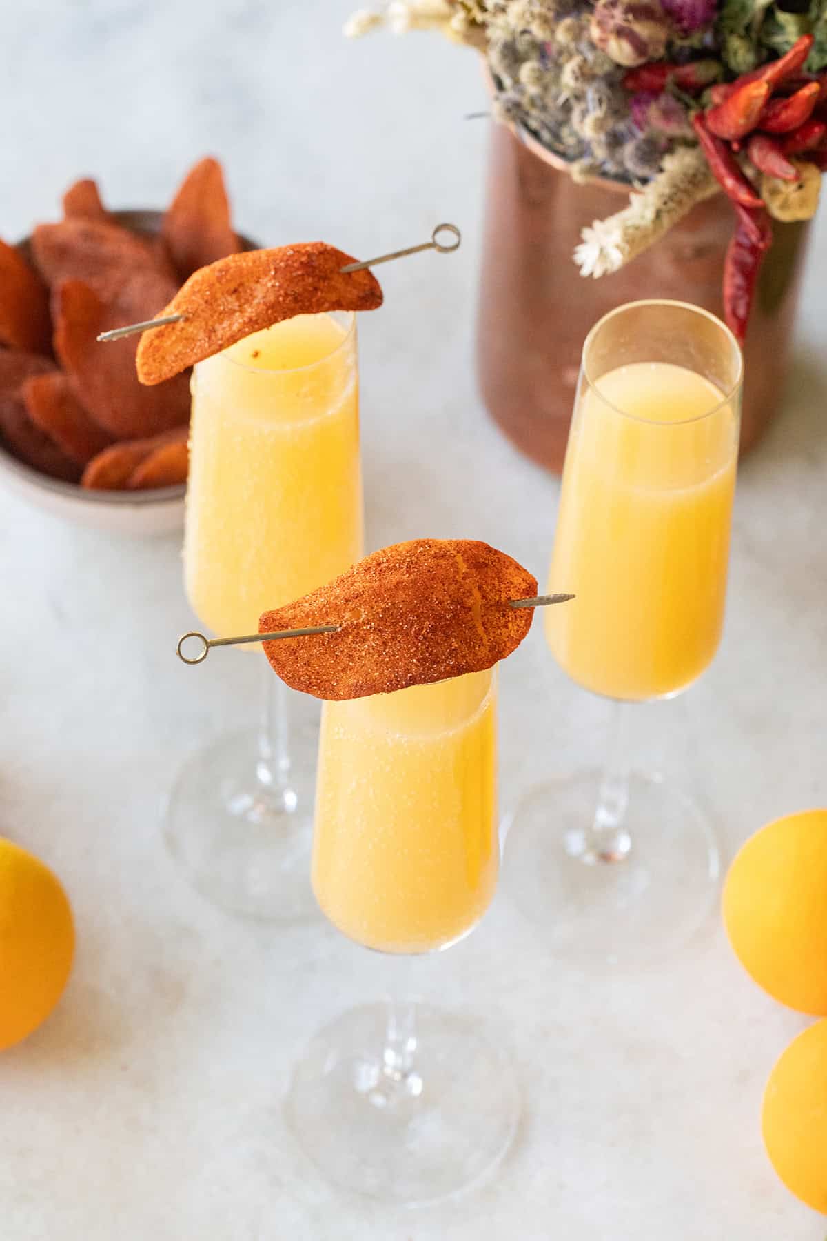 Mango mimosa recipe with mango juice and Prosecco.