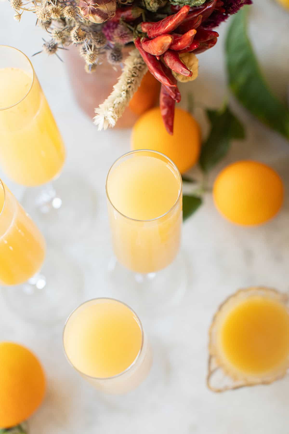 Recipe for mango mules in Champagne glasses.