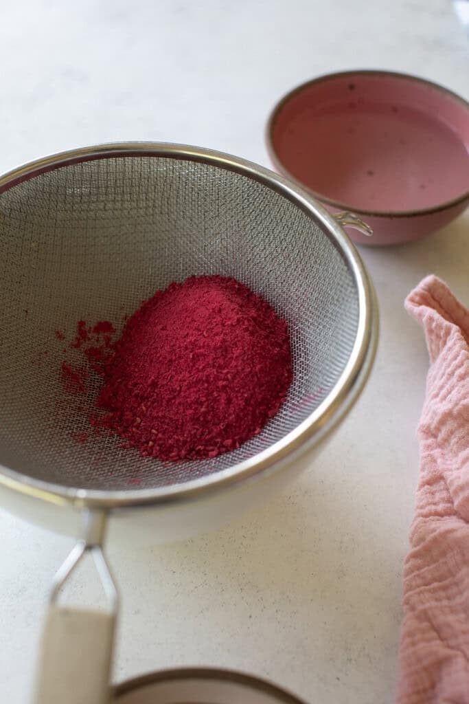 Freeze-dried raspberries in a sieve. 