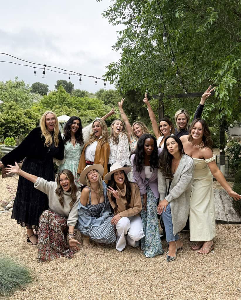 Group of friends smiling together at a brunch-style Favorite Things Party