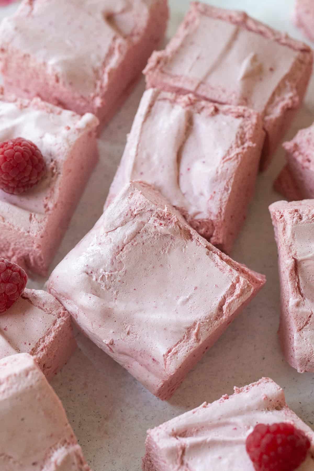 Fluffy homemade healthy marshmallows with raspberries. 