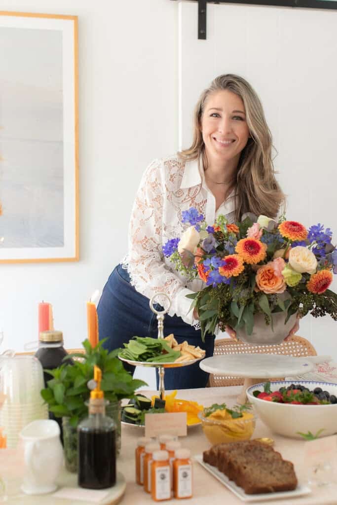 Eden Passante holding flowers at her Favorite Things Party.