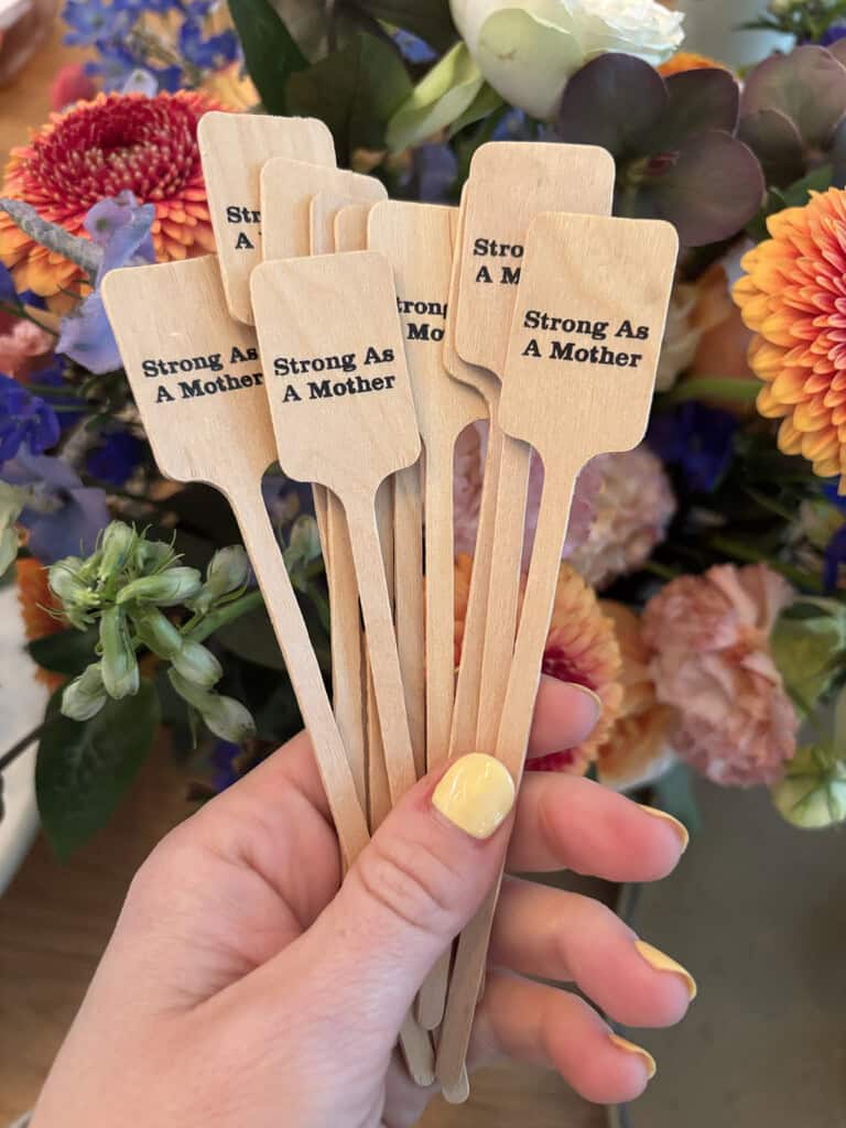 Close-up of charming cocktail drink stirrers on a party table setup
