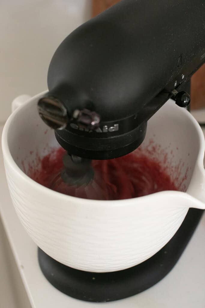 Whipping marshmallows in a mixer.