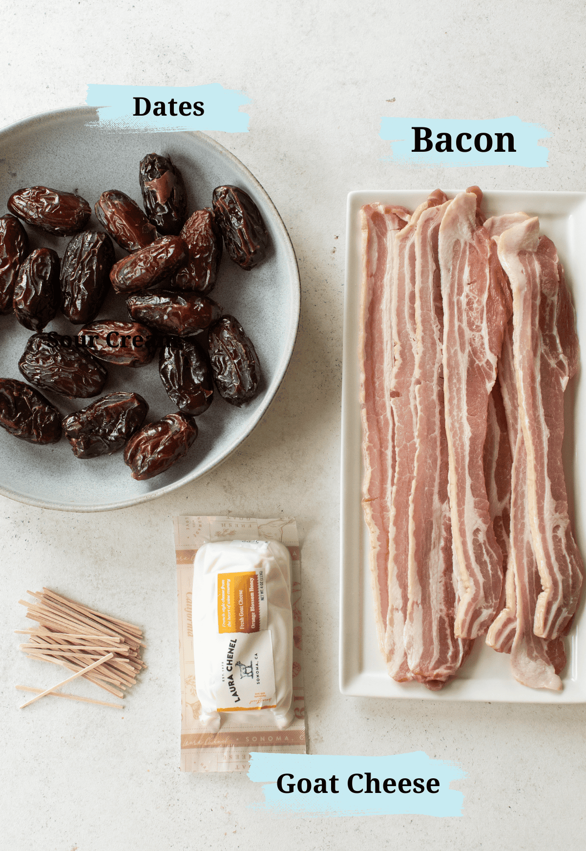 Bacon, dates and goat cheese on a table to make bacon wrapped dates.