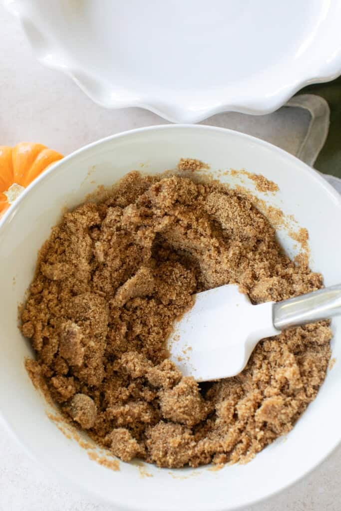 Making a graham cracker crust to use for a pie.