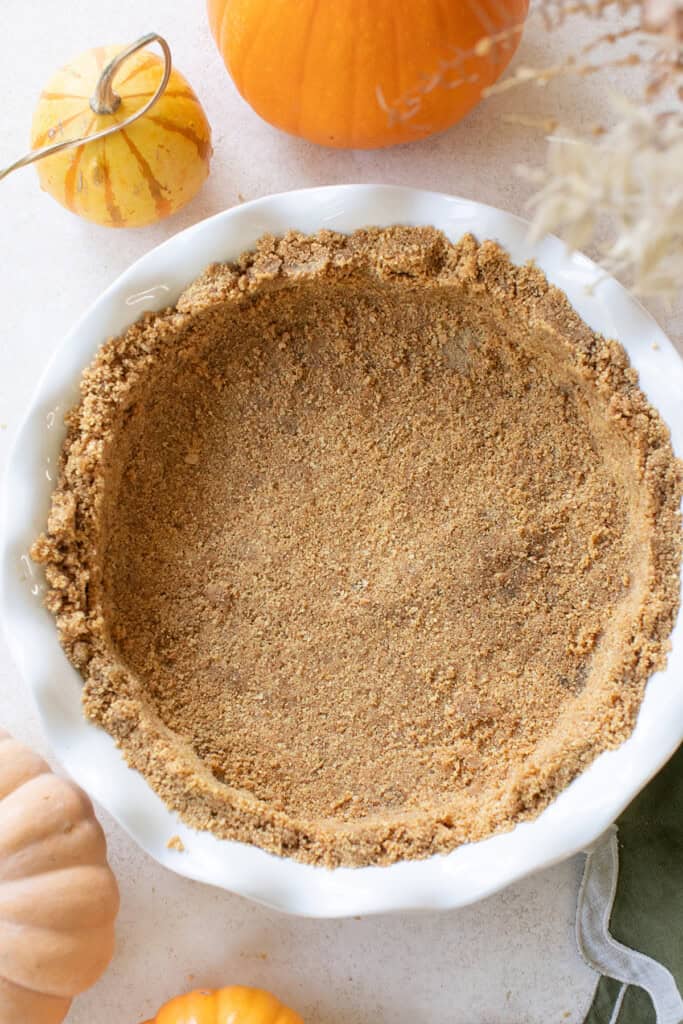 Buttery graham cracker crust in a pie dish.