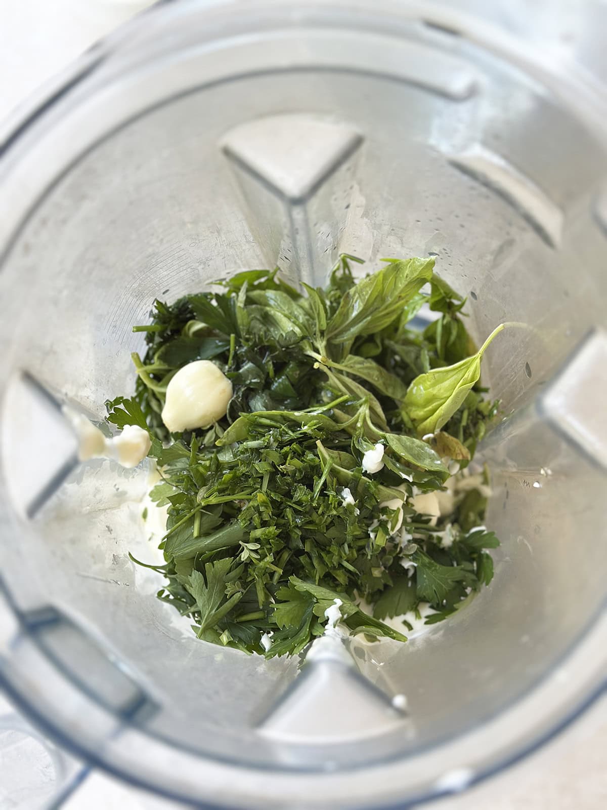 Ingredients in a blender to make green goddess dip.