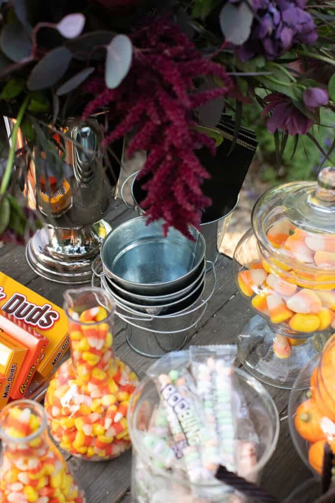Halloween candy bar with mini buckets and candy. 