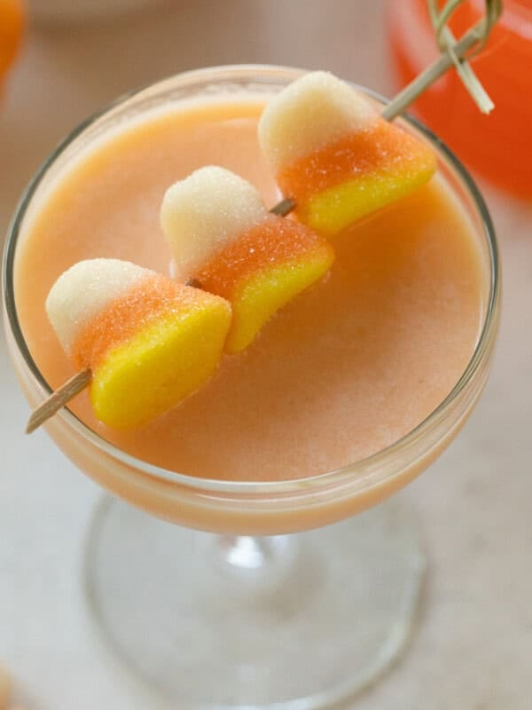 Candy corn martini with gummy candy corn garnishes.