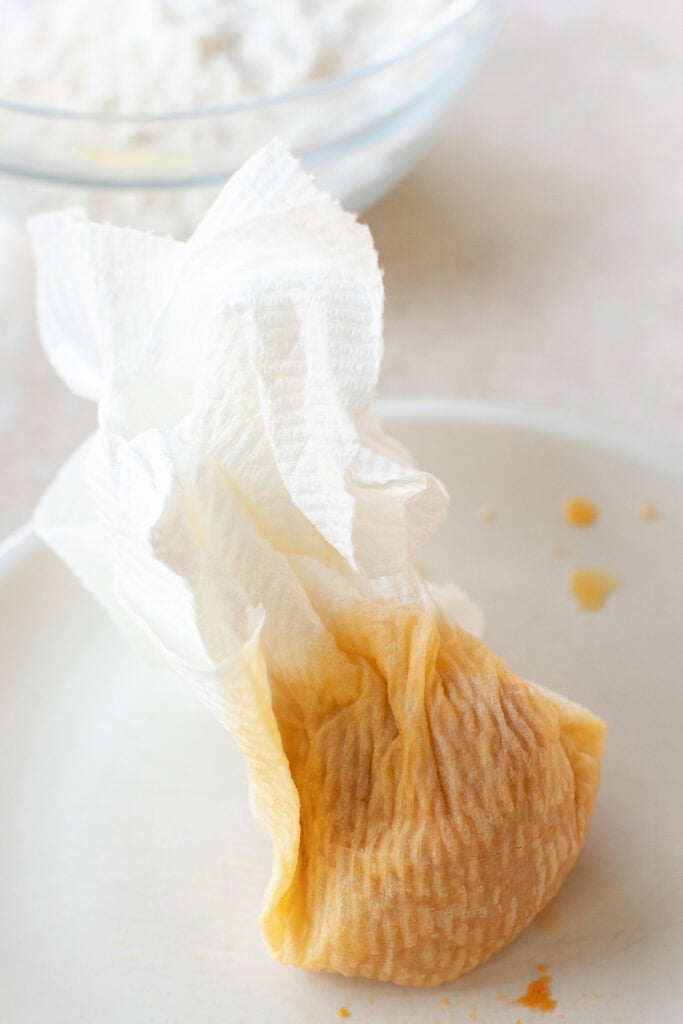 Pumpkin puree spread on paper towels to remove excess moisture.