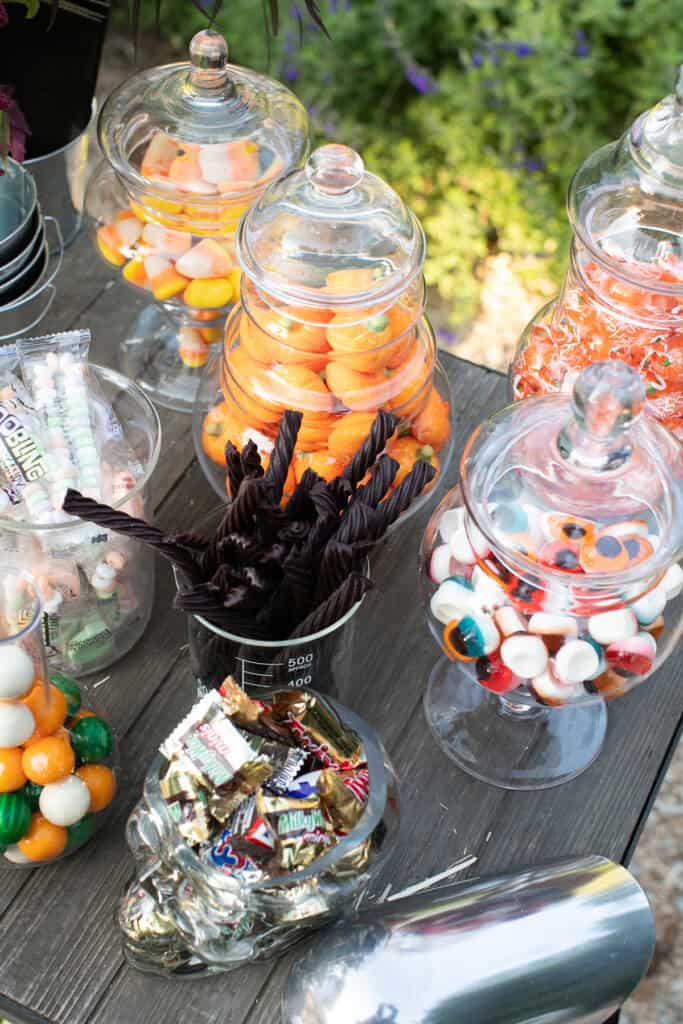Halloween movie night candy cart with Halloween themed candy.