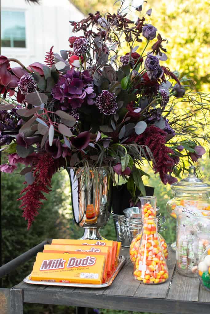 Halloween flowers on a candy cart.