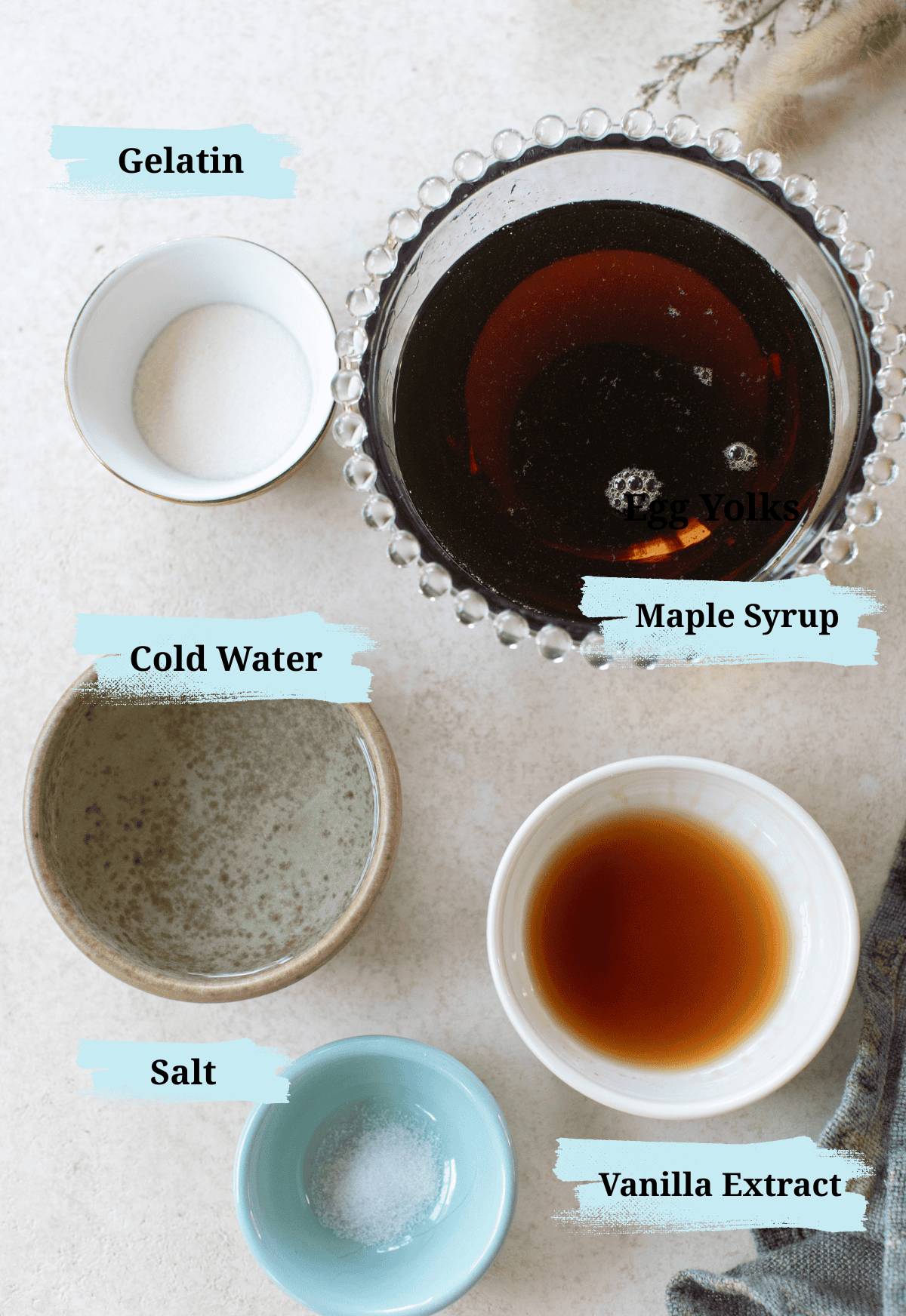 Ingredients in bowls to make maple syrup marshmallows.