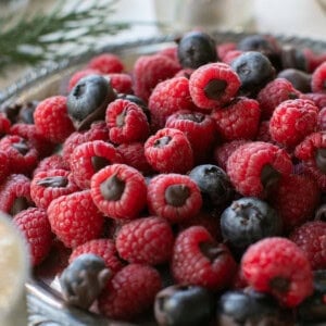 Chocolate covered berries on a platter.