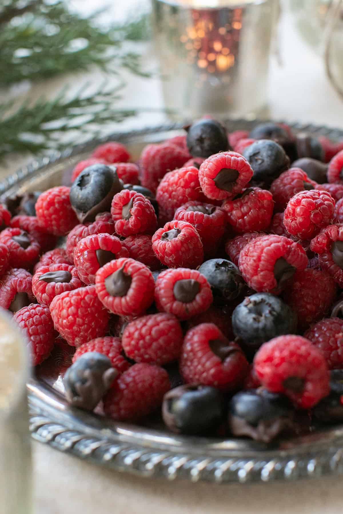 Chocolate covered berries on a platter.