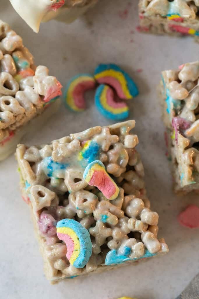 Gooey Lucky Charms Rice Krispie treats with marshmallows and cereal pieces.