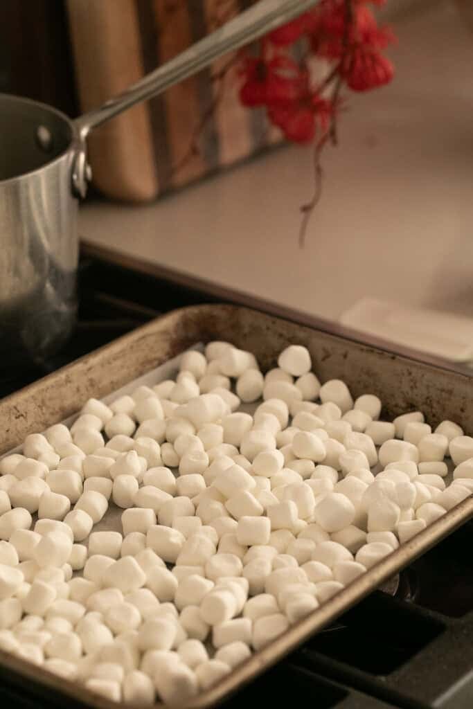Marshmallows on a pan to roast and make toasted marshmallow syrup.