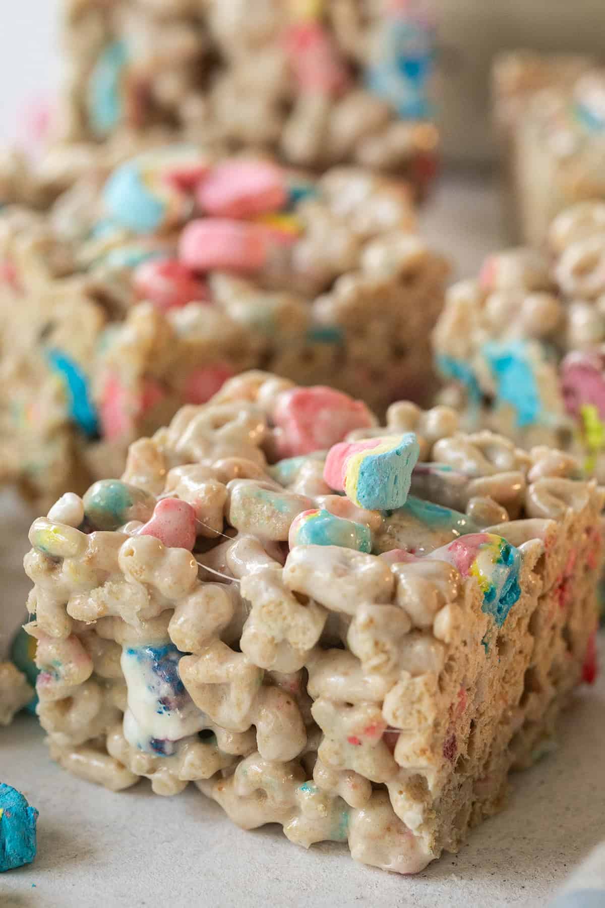 Gooey Lucky Charms Rice Krispie treats with marshmallows and cereal pieces