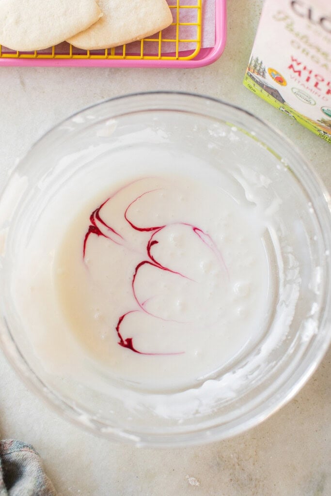 Marbled sugar cookie icing in a bowl.