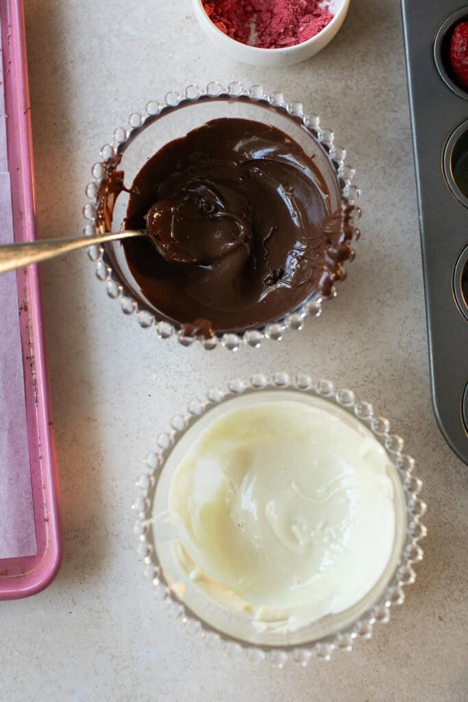 Delicious melted chocolate for dipping strawberry jello shots.