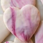 Heart shaped sugar cookie with marble swirl icing.