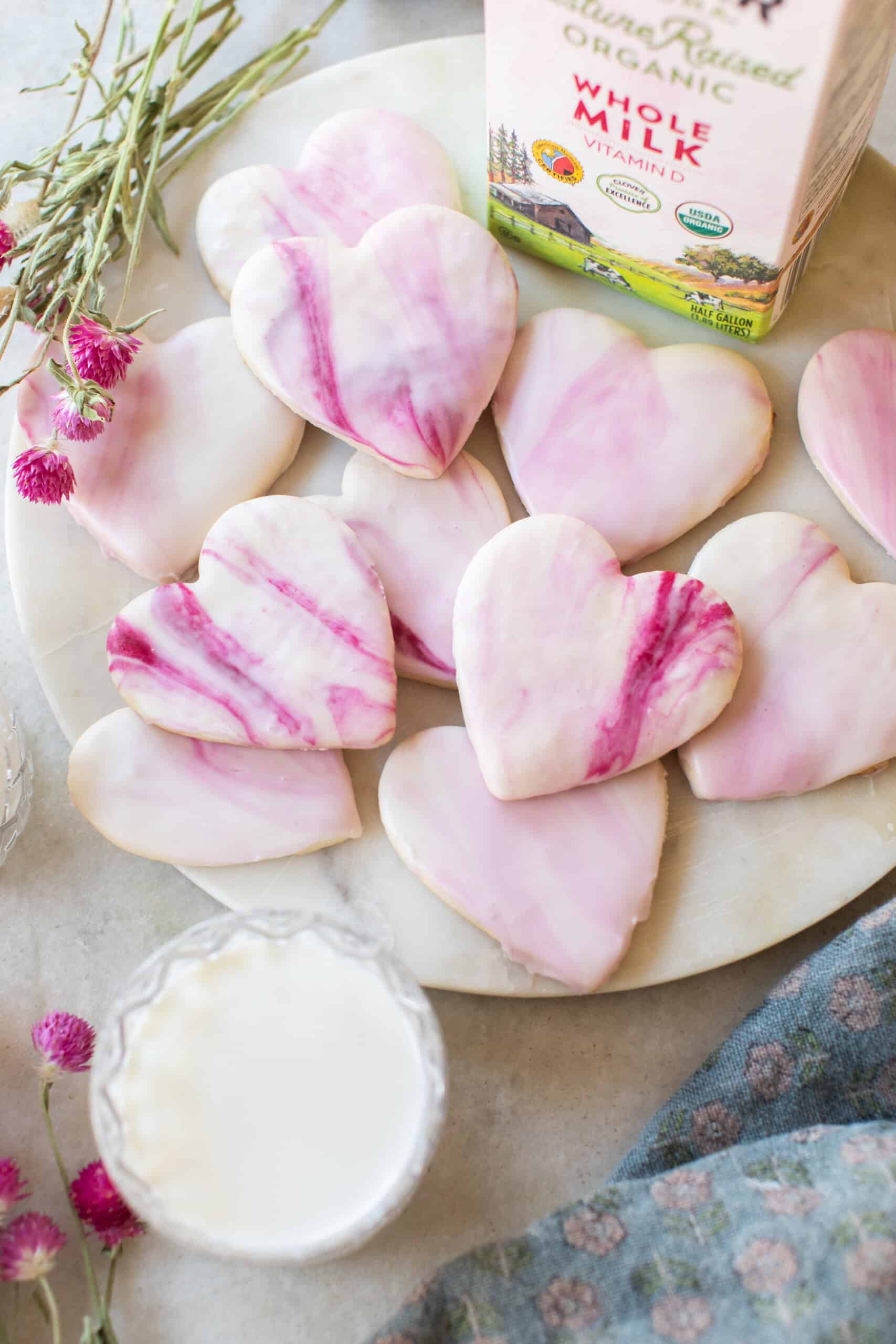 Heart-shaped marble sugar cookies on a platter for Valentine's Day.