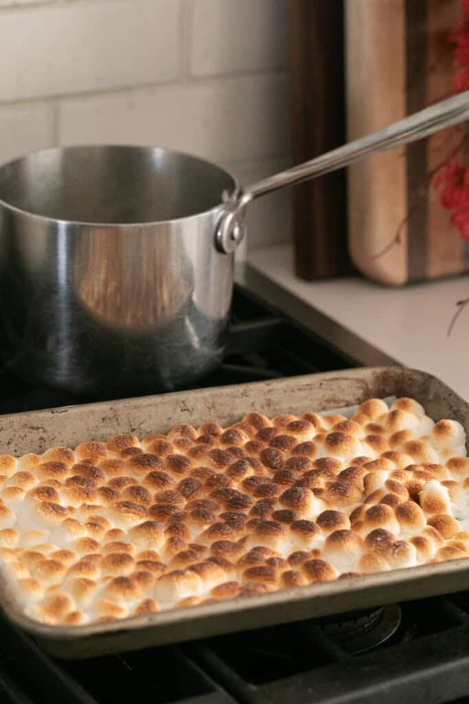 Toasted marshmallows on a pan.
