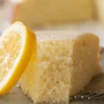Slice of a super moist lemon olive oil cake with glaze.