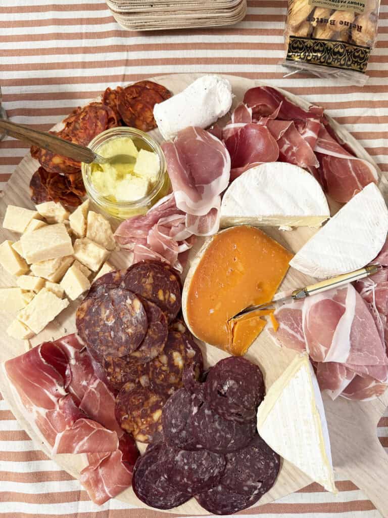 charcuterie board with Italian meats, cheeses, and olives