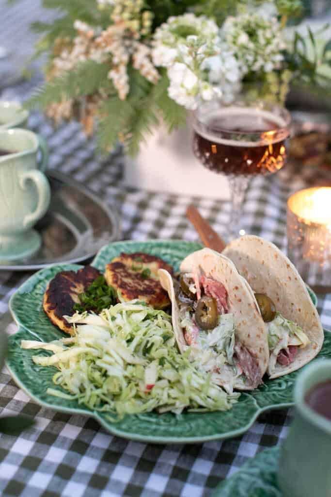 Corned beef hash tacos on a plate for a St. Patrick’s Day dinner party.