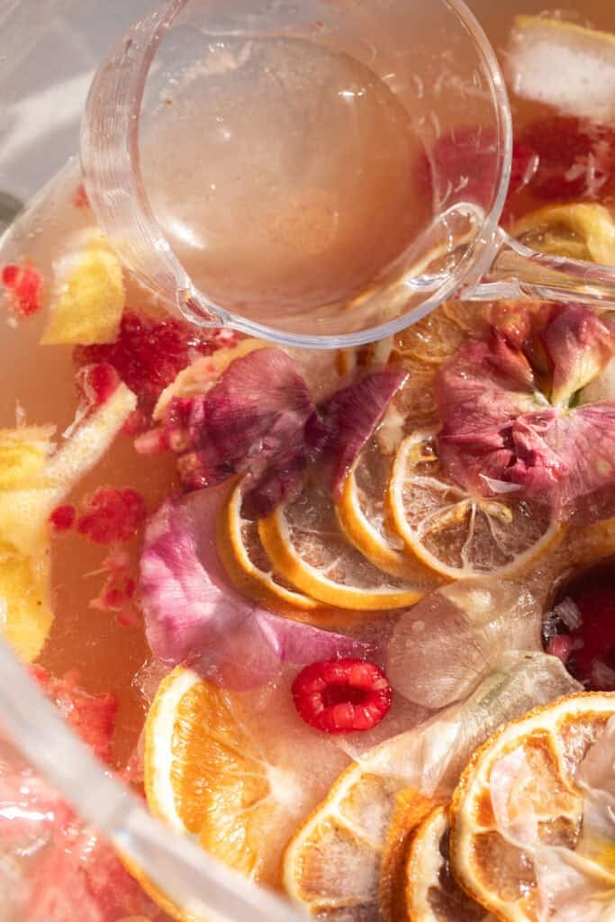 Champagne party punch with edible flowers.