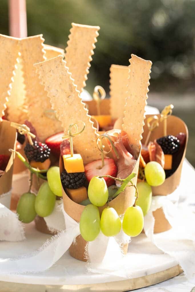 Charcuterie cups with grapes, cheese, crackers and more.