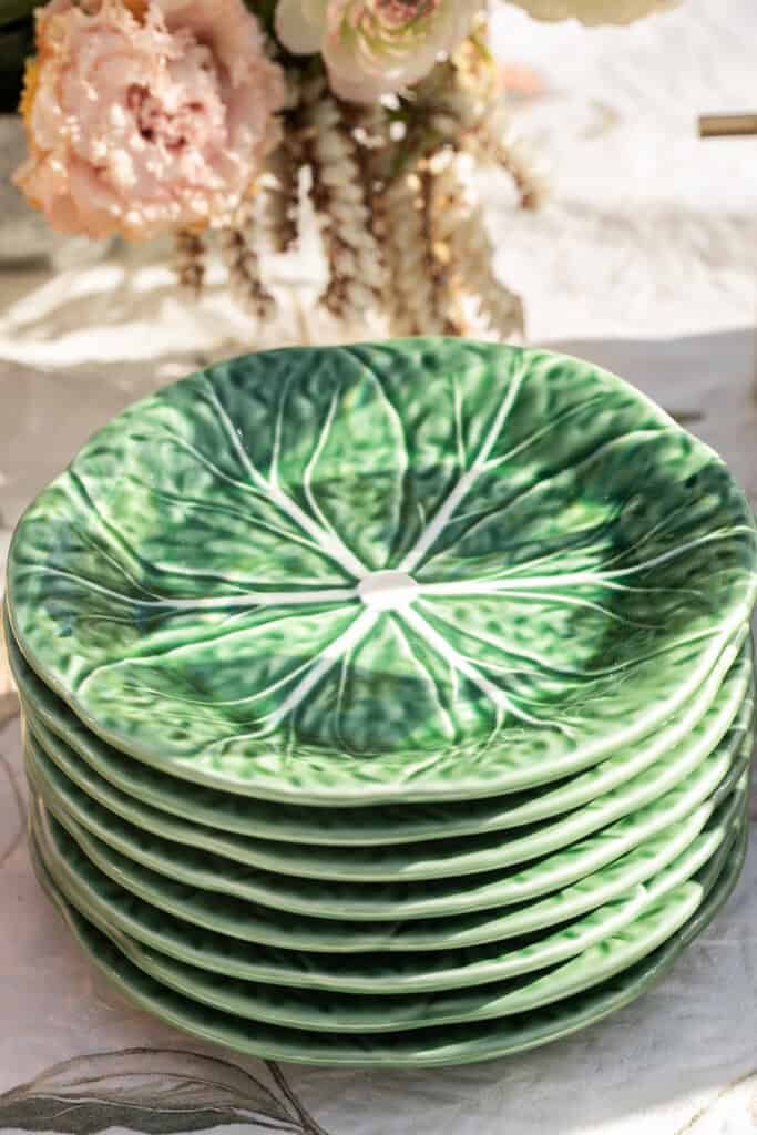 Cabbage plates stacked at a garden party.