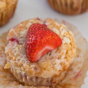 Moist strawberry muffins with fresh strawberries.