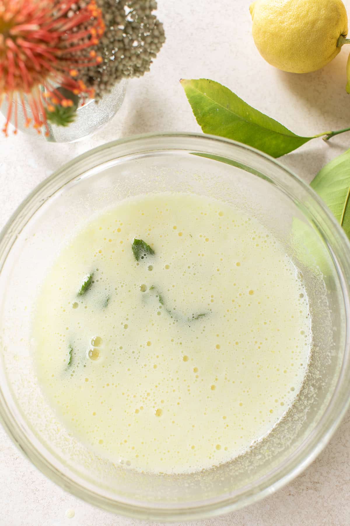 Gelatin blooming in fresh lemon juice for Hugo spritz jello shots.
