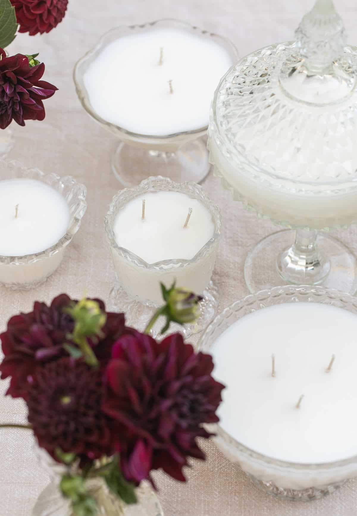 Freshly poured vintage glassware candles setting on a counter