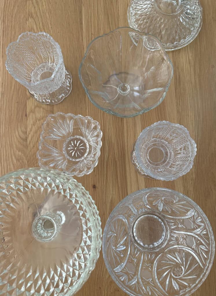 Vintage glass dishes and jars found at a thrift store for candle making.