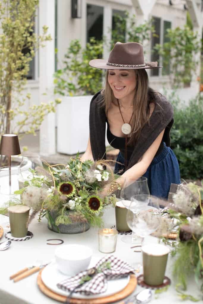 Eden Passante setting the table for a rodeo dinner party.