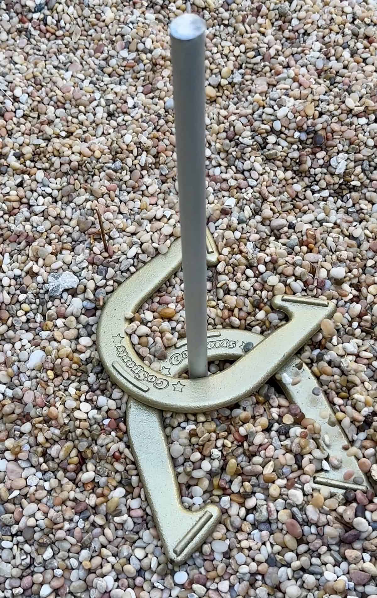 Horse shoes in the ground at a rodeo themed party.