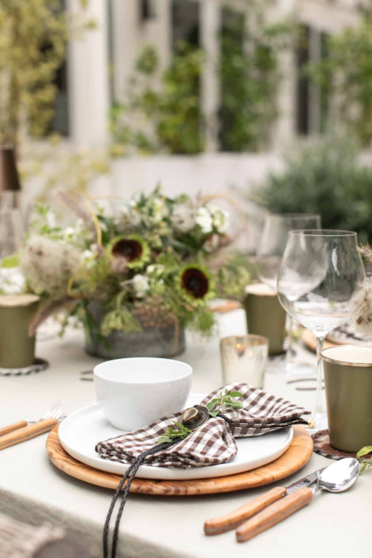 A rodeo dinner party table with a brown and green theme.