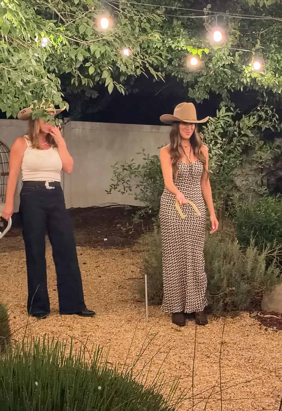 Rodeo girls playing horse shoes.
