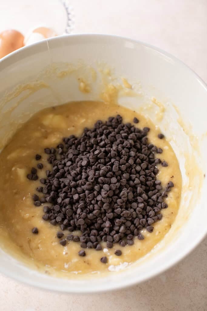 One-bowl banana muffin batter with mini semisweet chocolate chips.