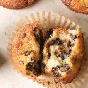 Moist banana chocolate chip muffins with mini chocolate chips on top.